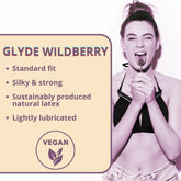 Promotional image for Glyde Ultra Organic Wildberry Flavored Vegan Condoms by Glyde, featuring a person playfully holding a lollipop. Highlights include the wildberry-flavored, standard fit, ultra-thin condoms that are silky and strong. Made with sustainably produced natural latex, these condoms are lightly lubricated and adorned with the vegan symbol.